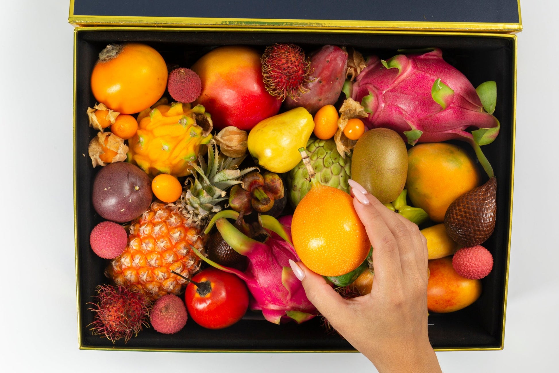Medium Exotic Fruit Variety Box Open W/hand