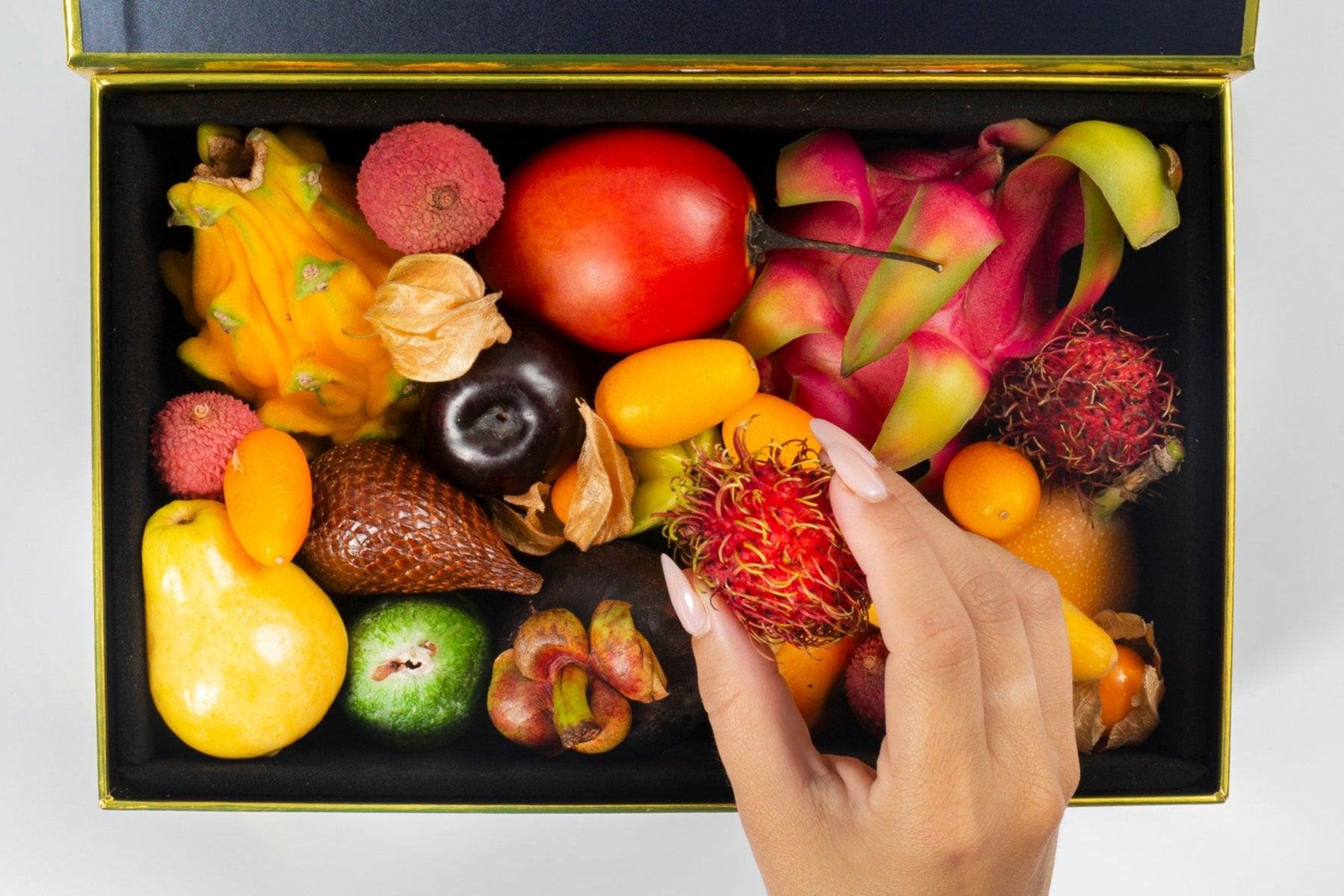 Small Exotic Fruit Variety Box Open W/hand