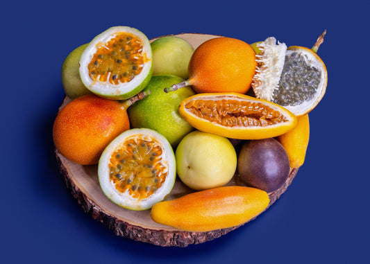 Assorted tropical passion fruits on a dark blue background
